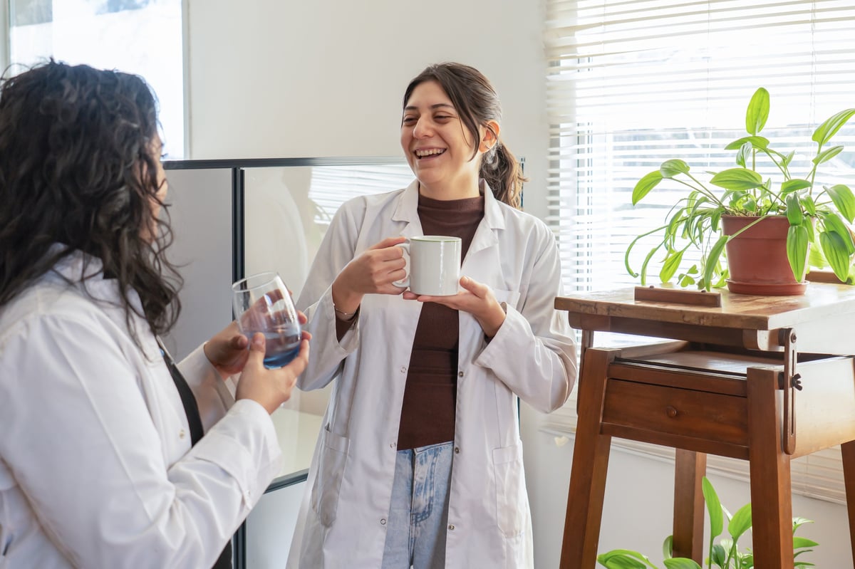Barista holding a mug during a coffee break